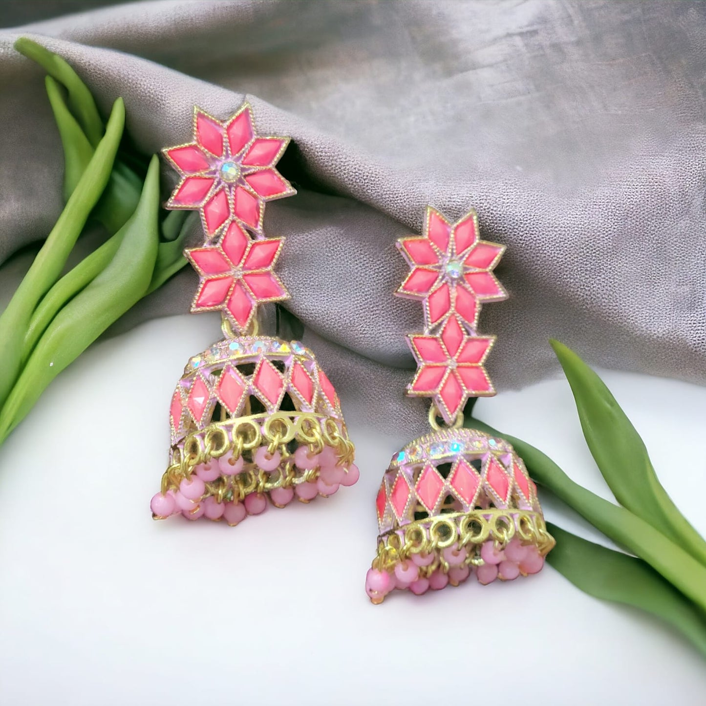 Carefully Crafted into Star-Shaped Pink Pearl Jhumka Earrings