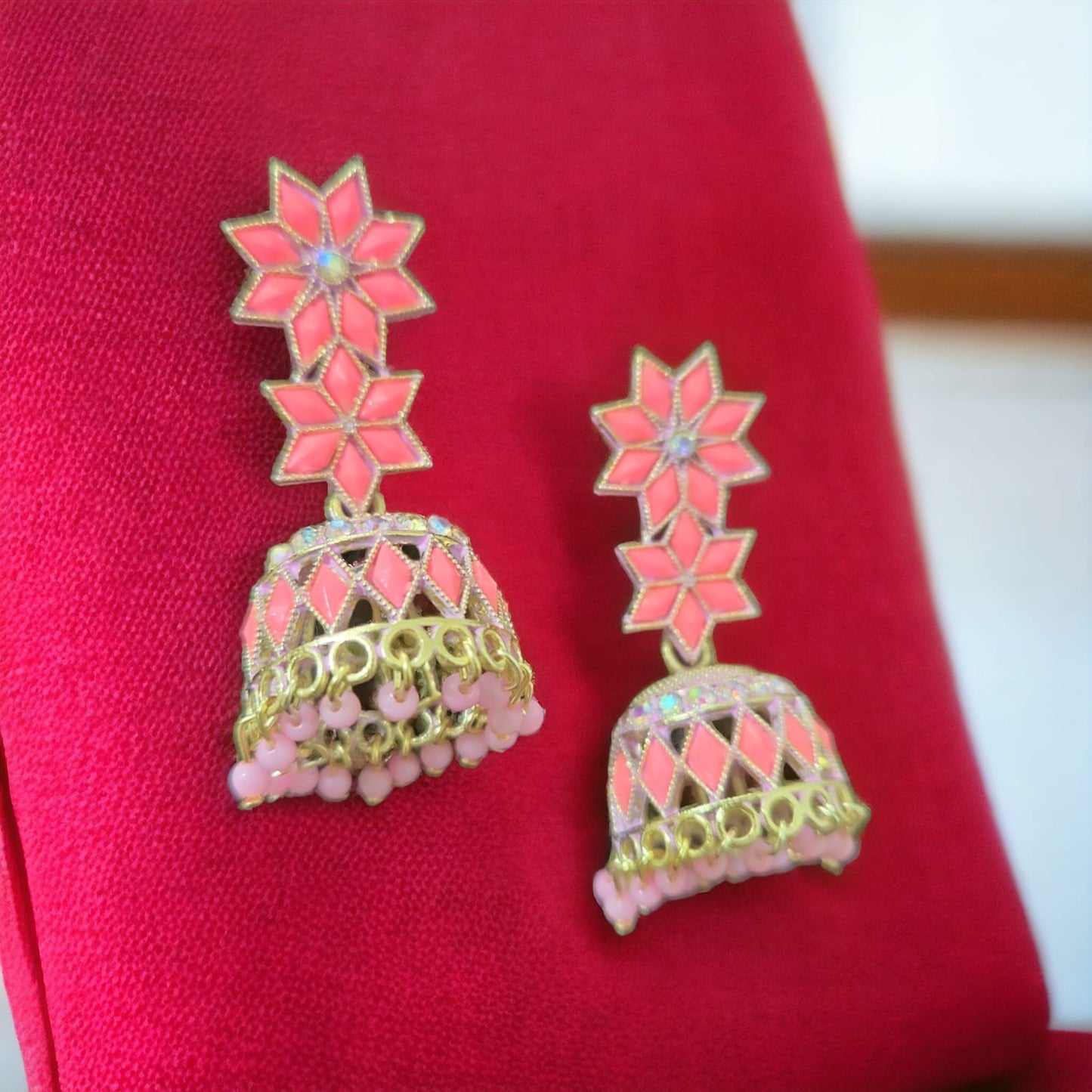 Carefully Crafted into Star-Shaped Pink Pearl Jhumka Earrings
